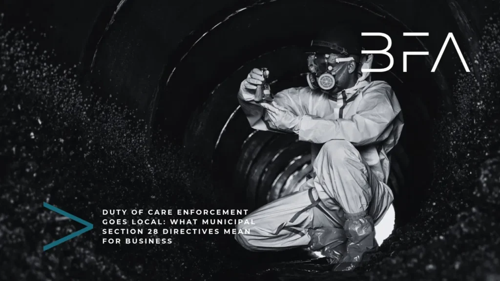 Inspector in protective gear taking a pollution sample inside a drainage pipe